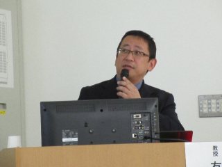 有馬 久富氏による講演 写真:有馬 久富氏による講演