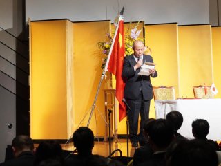 President Uemoto giving his greeting speech