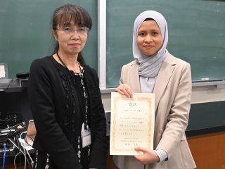 Asmaa, Intermediate 2 Class Winner, with Board Chair Akada